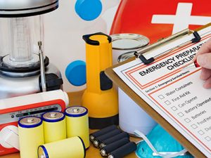 Person using an emergency preparedness checklist